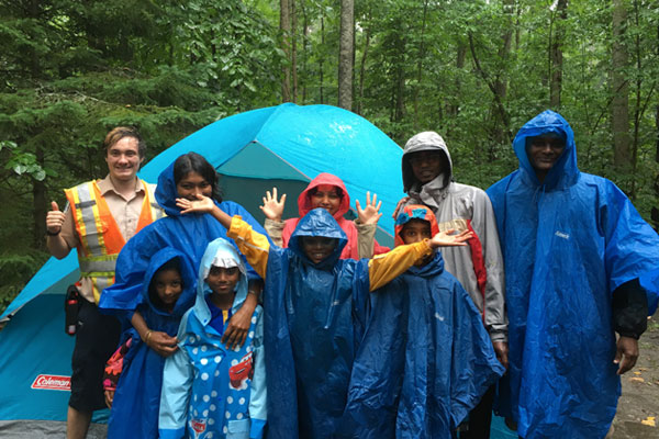 group wearing rain coats
